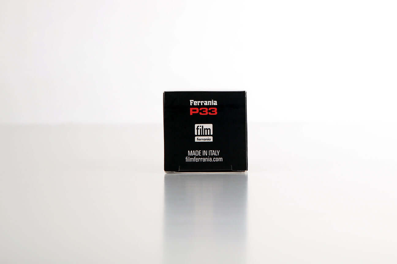 Ferrania P33 160 ISO Black and White (35mm Roll, 36 Exposures) packaging on a minimalist background.