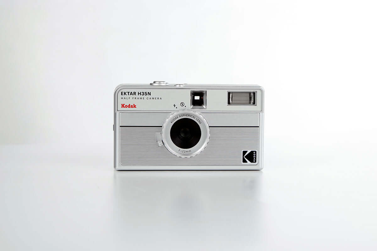 Kodak Ektar H35N Half Frame Film Camera (Striped Silver) front view on a white background