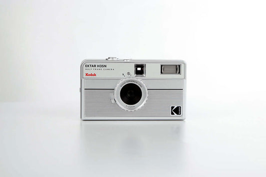 Kodak Ektar H35N Half Frame Film Camera (Striped Silver) front view on a white background