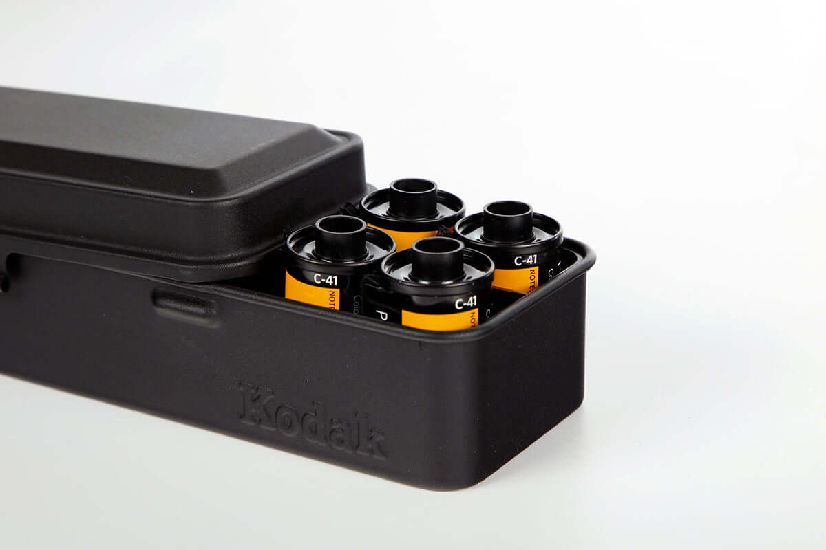 Open view of a Kodak 135/120 film case in the color black.