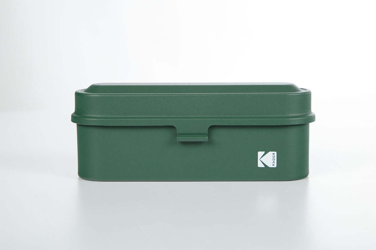 Kodak 135 film case in the color green.
