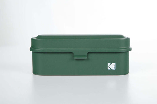 Kodak 135 film case in the color green.
