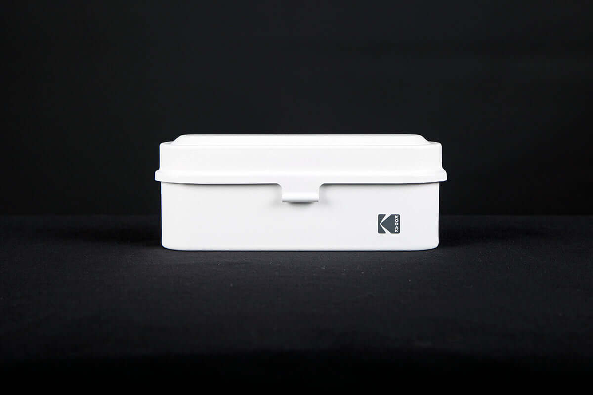 Kodak 135 film case in the color white.