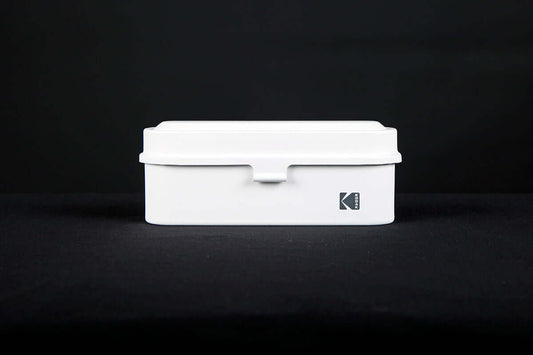 Kodak 135 film case in the color white.