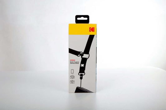 Kodak Multi-Purpose Camera Strap (Black) packaging with adjustable neck and crossbody strap design.