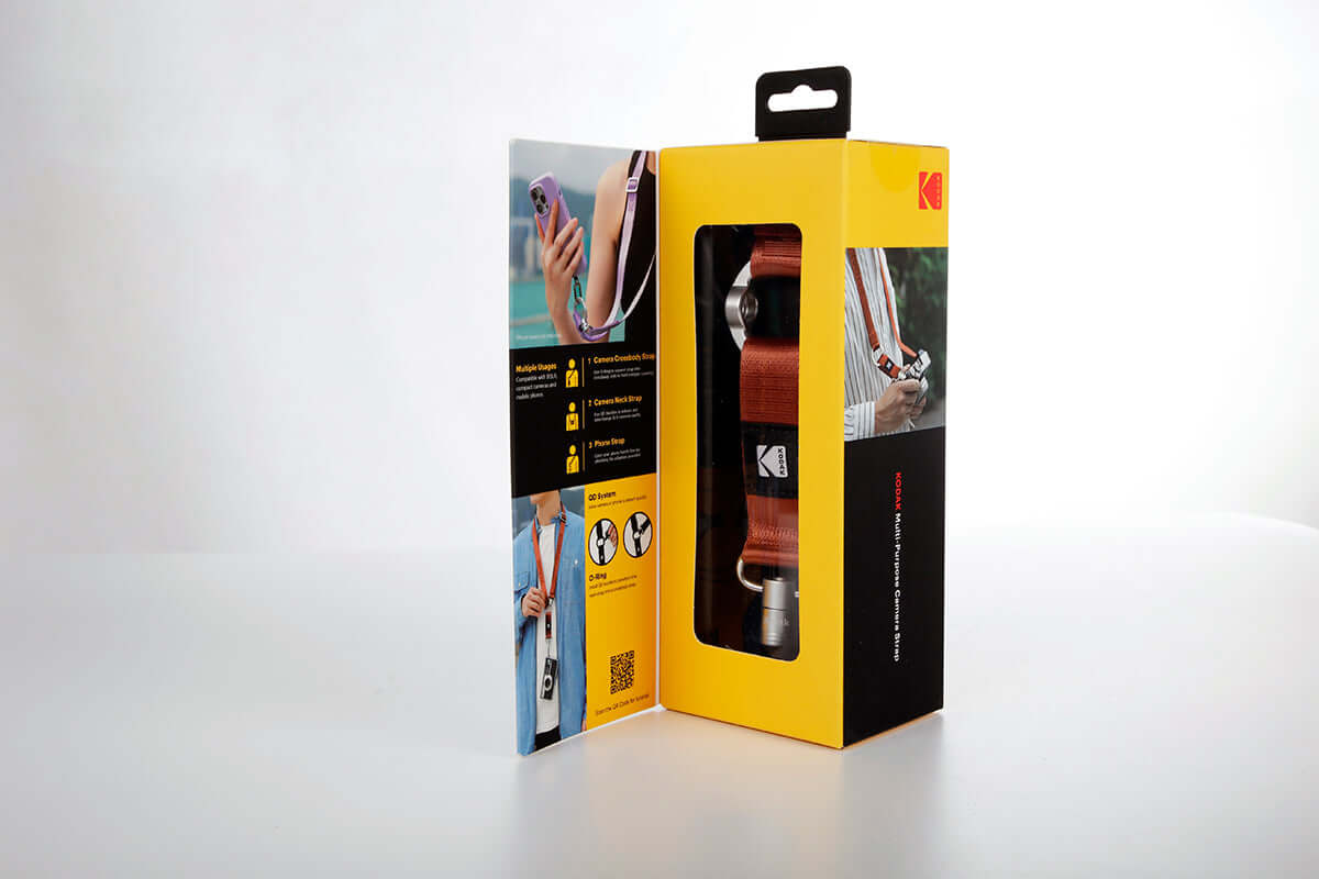 Kodak Multi-Purpose Camera Strap (Burgundy) in packaging, showcasing adjustable design and Quick-Detach System.