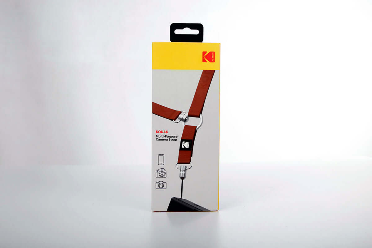 Kodak Multi-Purpose Camera Strap (Burgundy) packaging showing features and design.