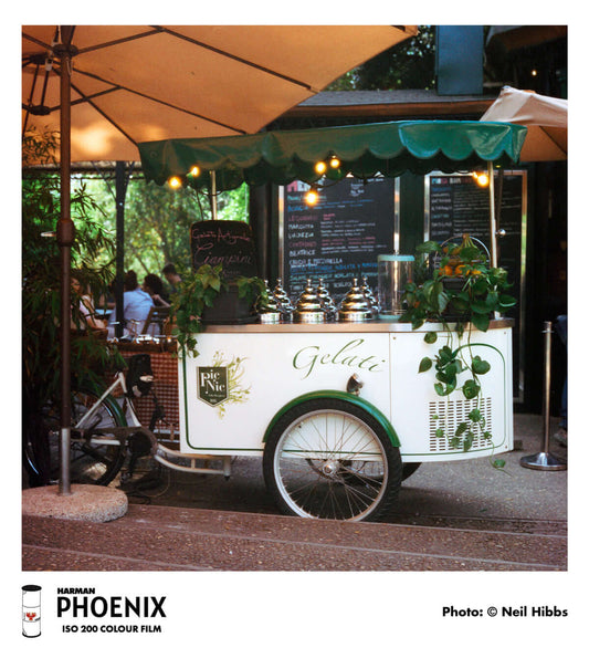 Harman Phoenix 200 Color Negative Film (120 Roll Film) gelato cart in urban setting, showcasing colors and details.