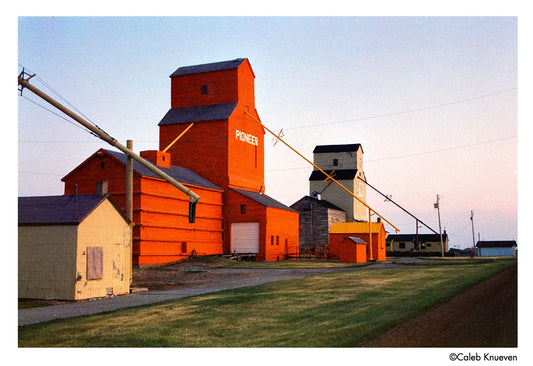 Harman Phoenix II 200 color negative film displayed against a vibrant backdrop of a vintage grain elevator.