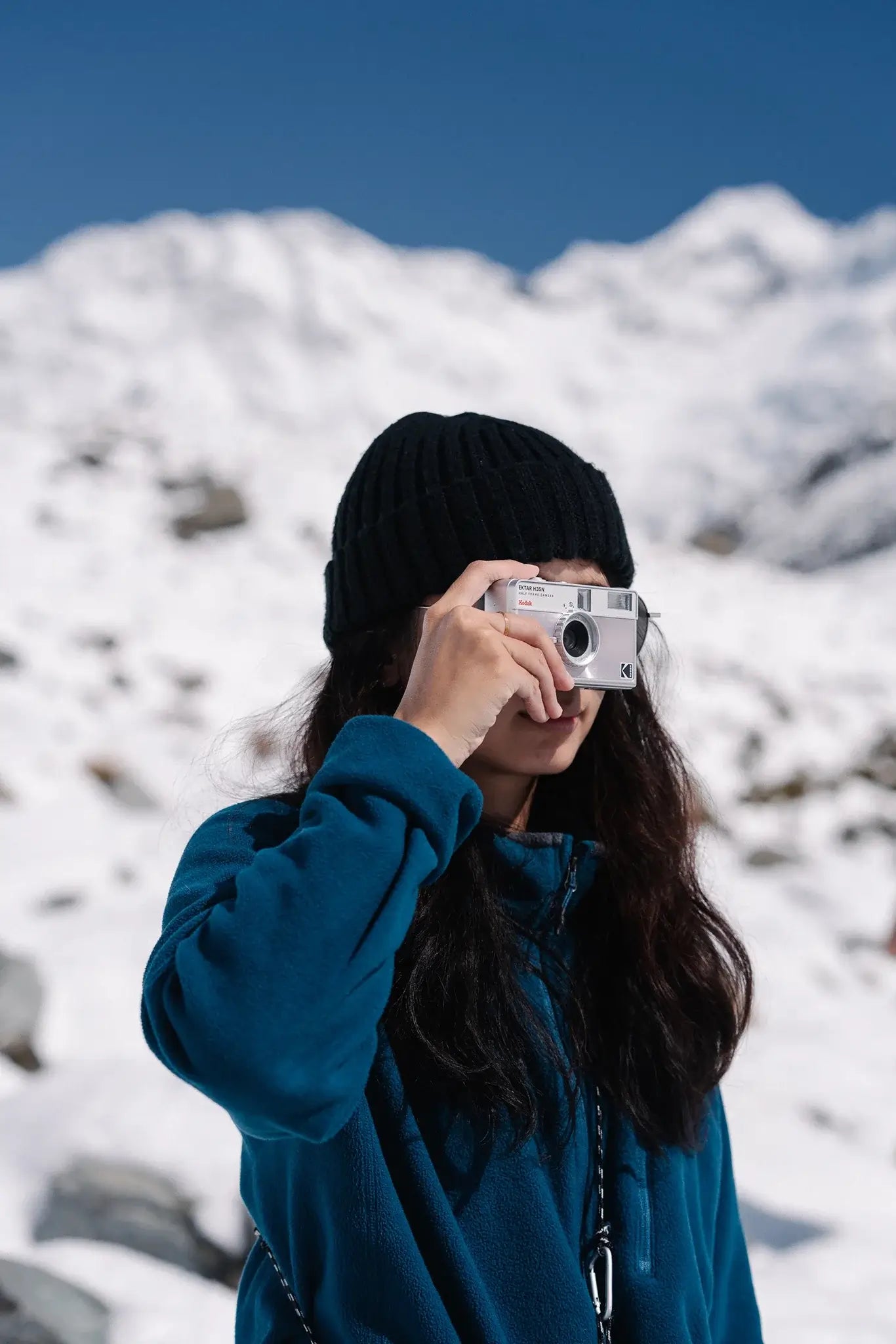 Kodak Ektar H35N Half Frame Film Camera (Striped Silver) being used in snowy landscape.