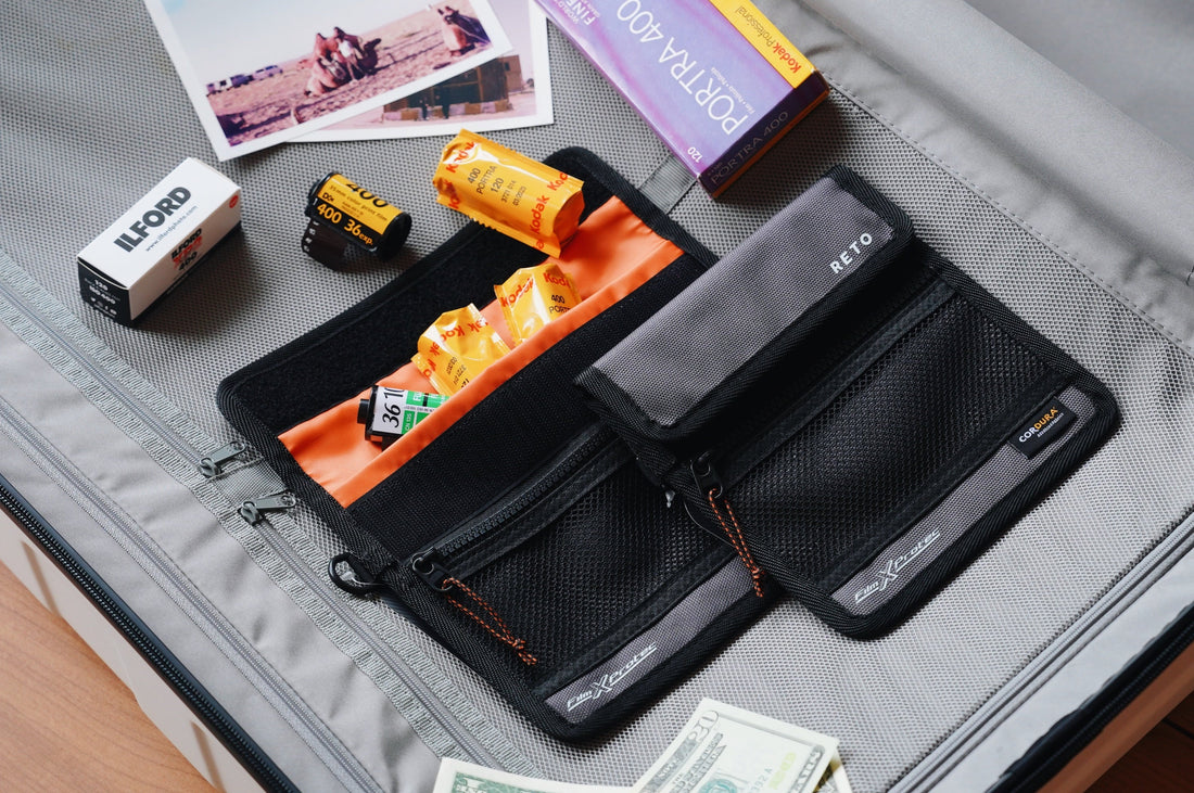 Traveling with film essentials, including film rolls, storage containers, and photography accessories.
