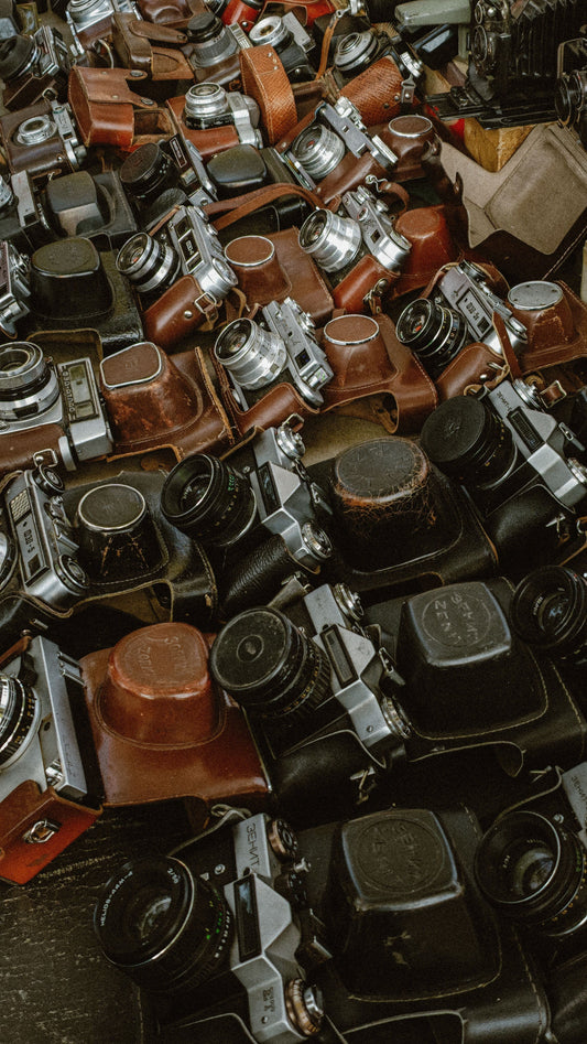 Collection of vintage cameras showcasing the art of shooting with vintage cameras.