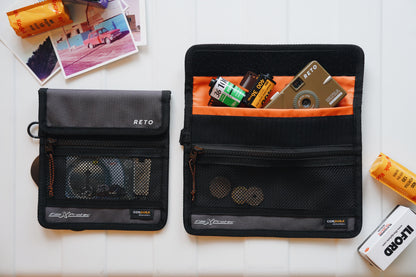 RETO Film X-Protec Bag (Small) displayed with film rolls and accessories on a flat surface.