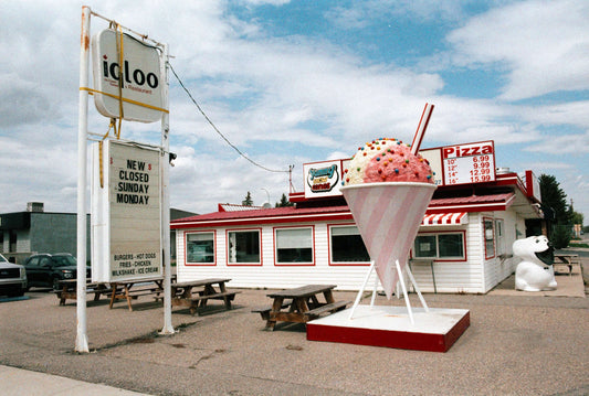 Street Candy Tasty 200 Color Negative Film displayed near ice cream shop sign and pizza restaurant.