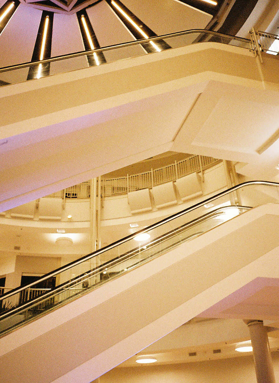 Interior view of modern architecture featuring staircases and a circular atrium design.