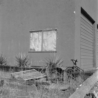 Kodak Tri-X 400 Black and White Negative Film (120 Roll Film, 5-Pack) image of an abandoned building with a window and bike.