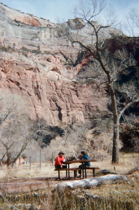 Kodak Sport Waterproof Disposable Camera ISO 800 (27 Exposures) used by two people at a picnic table in a canyon.