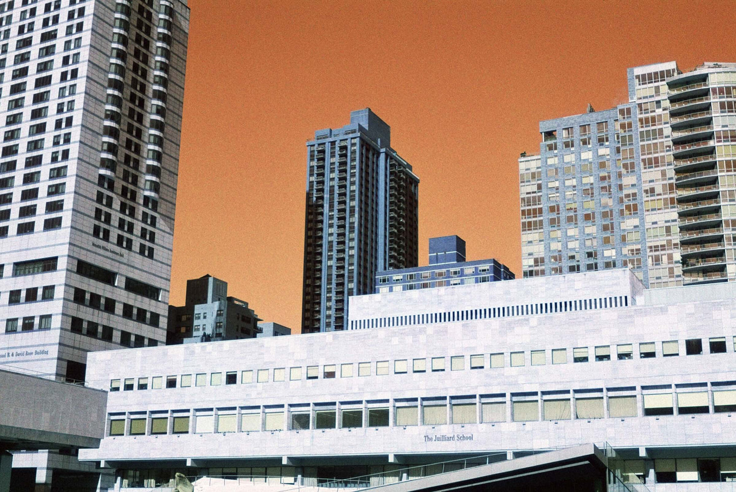 Harman Switch Azure 125 color negative film showcasing city skyline with orange sky and buildings.