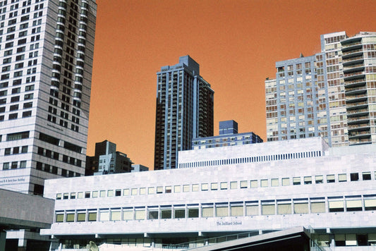 Harman Switch Azure 125 color negative film showcasing city skyline with orange sky and buildings.