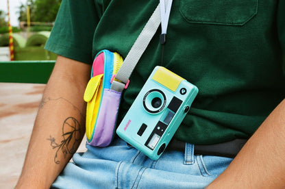 Dubblefilm SHOW 35mm Reusable Camera (Turquoise) on wearable accessory with built-in flash and turquoise body