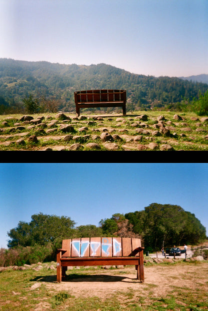Two rustic benches in an open field with hills and blue sky; inviting outdoor seating with natural landscape, shot using Ektar H35 Half Frame camera.