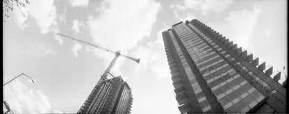 Flic Film UltraPan 400 Black and White Negative Film (35mm Roll, 36 Exposures) captures a city skyline.