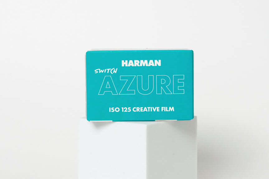 Harman Switch Azure 125 color negative film package on a pedestal with creative design.