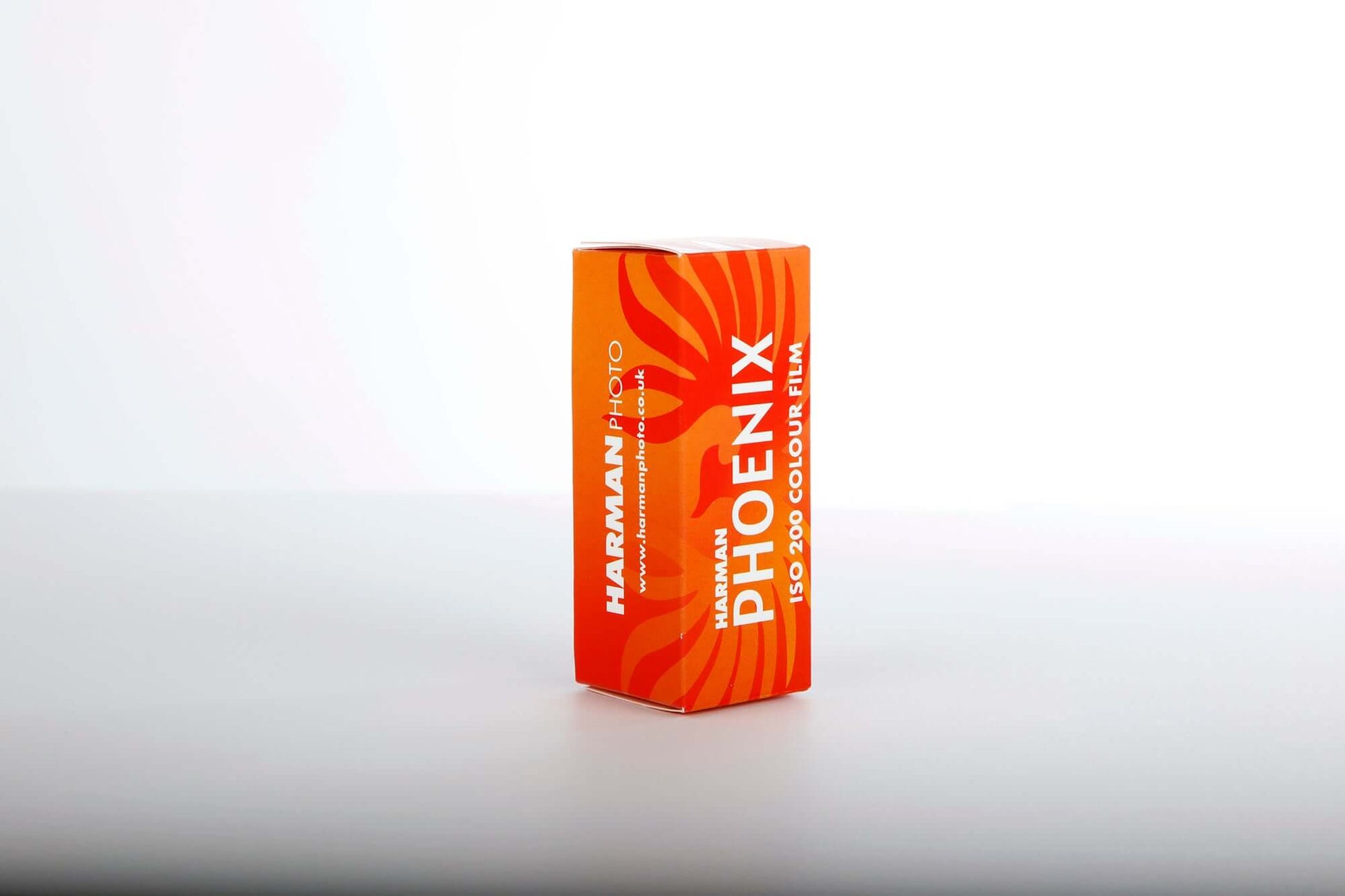 HARMAN Phoenix 200 color negative film box, 120 roll film, vibrant orange packaging.