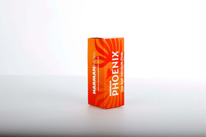 HARMAN Phoenix 200 color negative film box, 120 roll film, vibrant orange packaging.