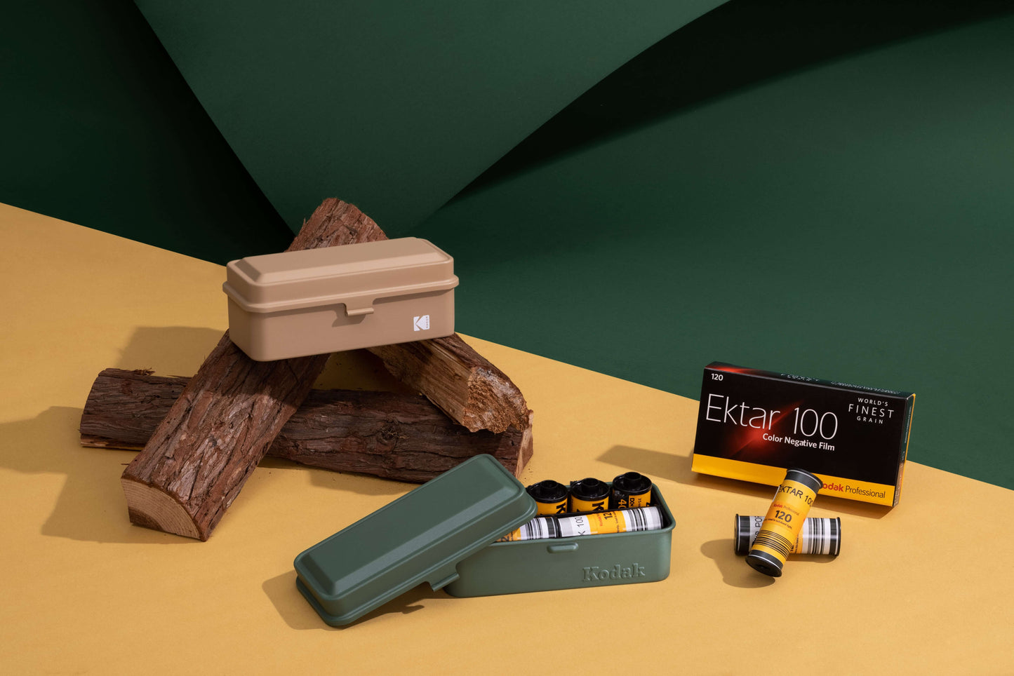 Kodak 120/135 Film Case (Green) with film rolls and Ektar 100 packaging on a colorful surface
