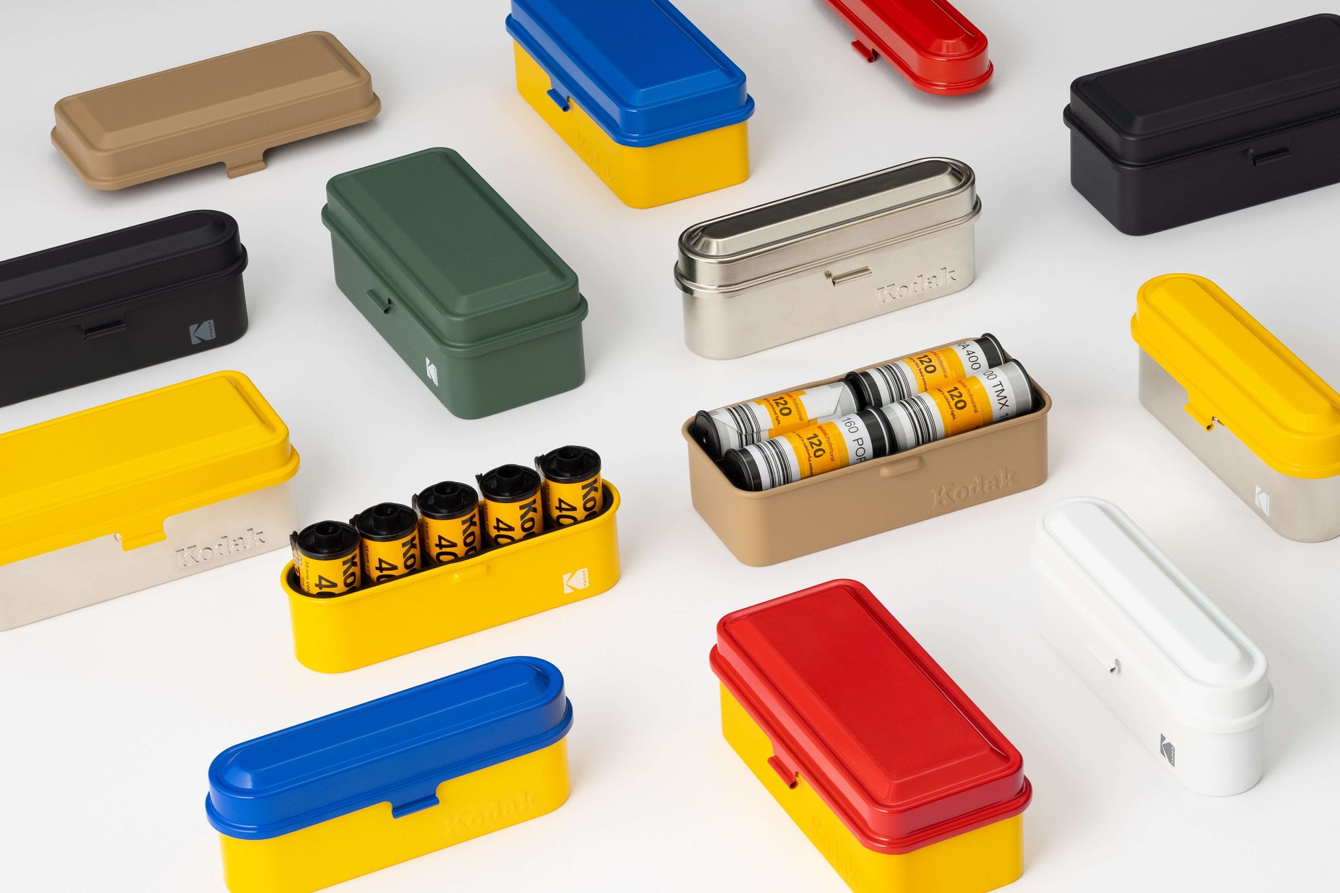Kodak 135 Film Case (Silver) and various colorful Kodak 120/135 film cases for preserving film rolls.