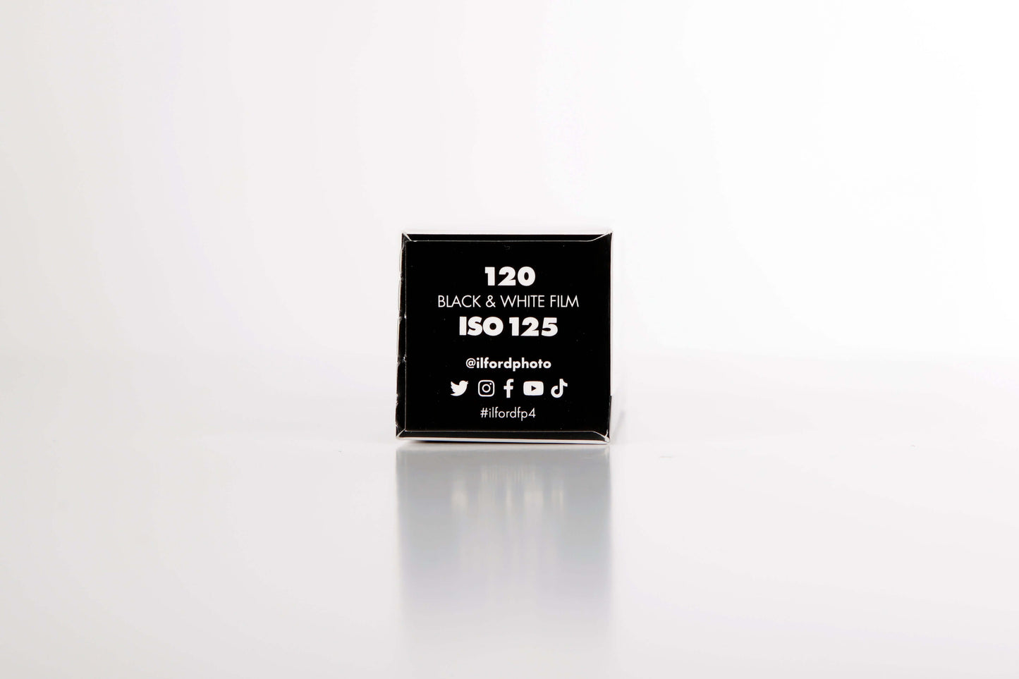 Ilford FP4 Plus B&W 120 film box displaying ISO 125 for fine grain and medium contrast photography.