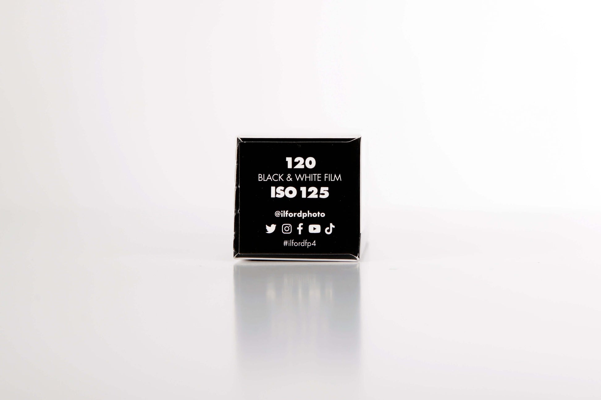 Ilford FP4 Plus B&W 120 film box displaying ISO 125 for fine grain and medium contrast photography.