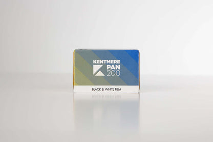 Kentmere Pan 200 Black & White Negative Film (35mm, 36 Exposures) packaging on a reflective surface.