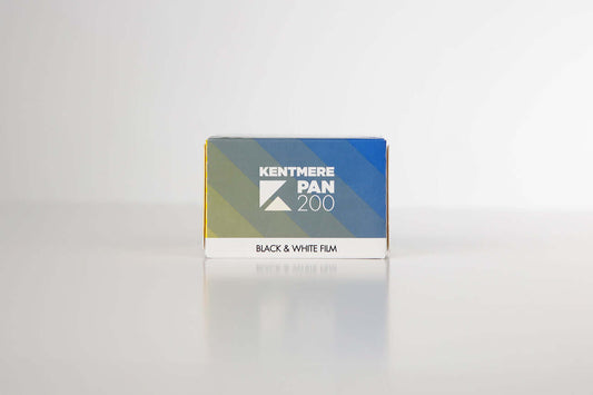 Kentmere Pan 200 Black & White Negative Film (35mm, 36 Exposures) packaging on a reflective surface.