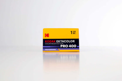 Kodak Ektacolor Pro 400 Color Negative Film (35mm Roll Film, 36 Exposures) packaging on a reflective surface.