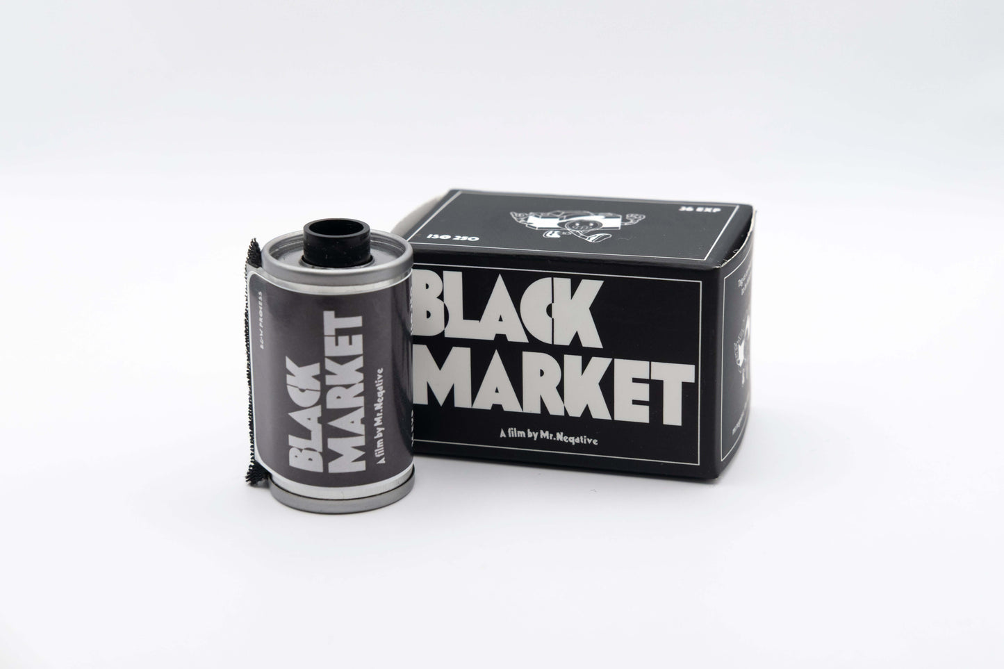 Mr Negative Black Market 250 black and white film roll and packaging on white background.