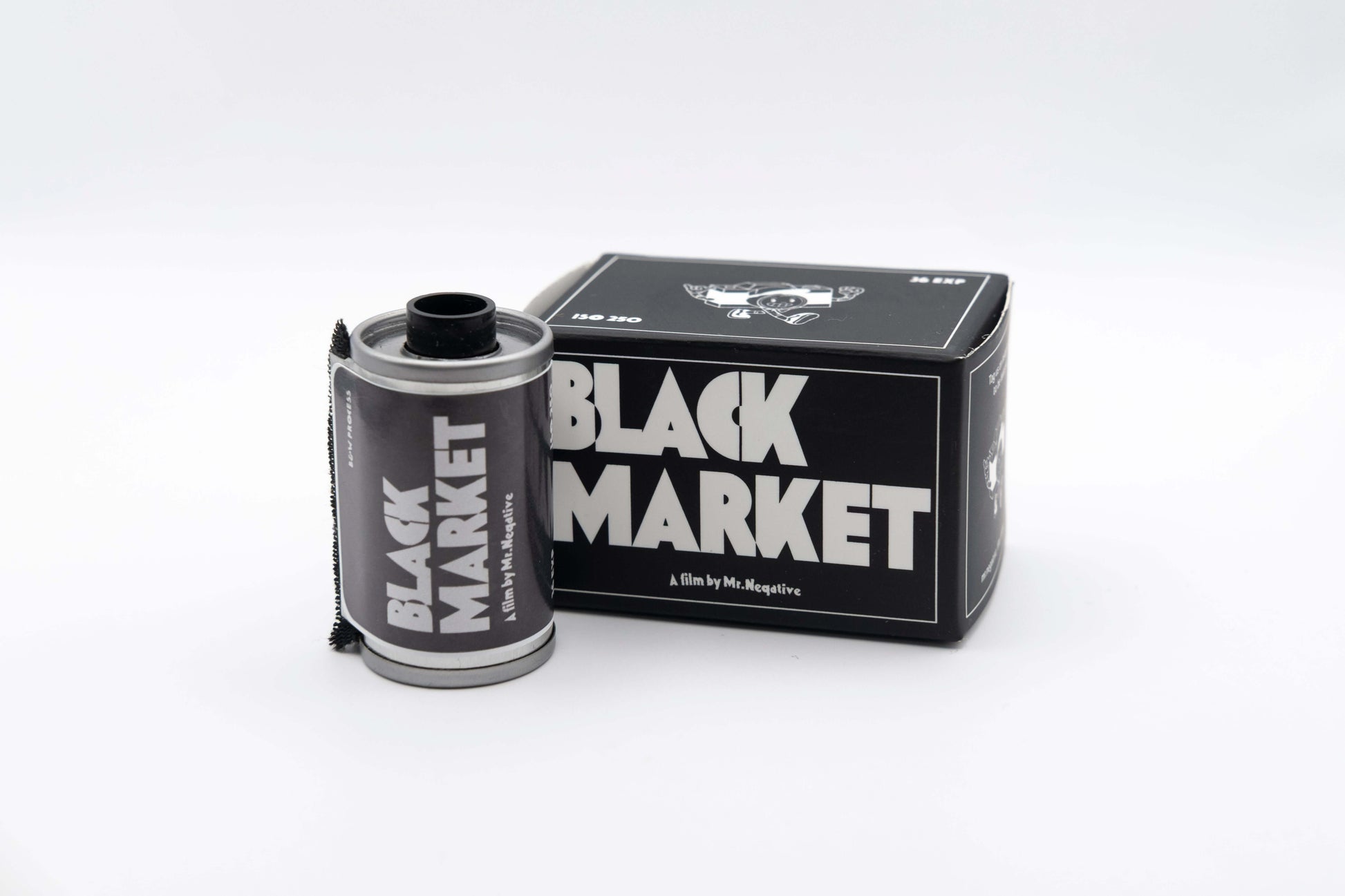 Mr Negative Black Market 250 black and white film roll and packaging on white background.