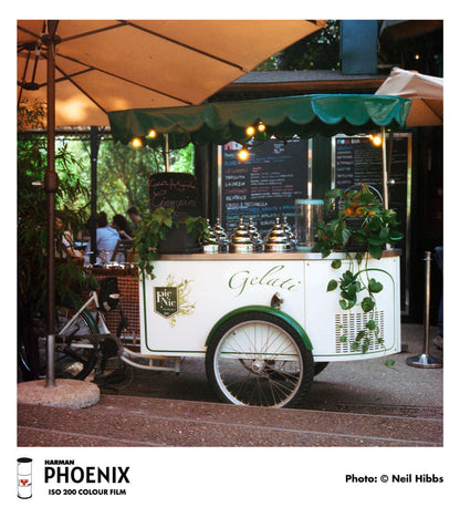 Harman Phoenix 200 Color Negative Film (120 Roll Film) gelato cart in urban setting, showcasing colors and details.