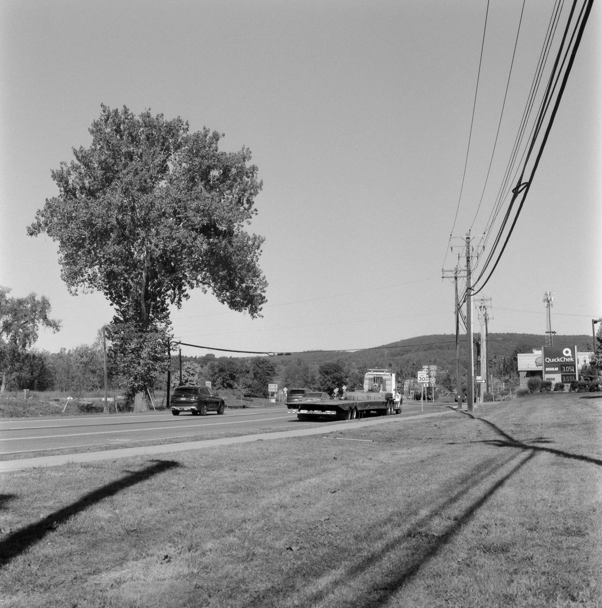 Ilford SFX 200 Black and White Negative Film (35mm Roll, 36 Exposures) capturing a scenic roadside view with trees.