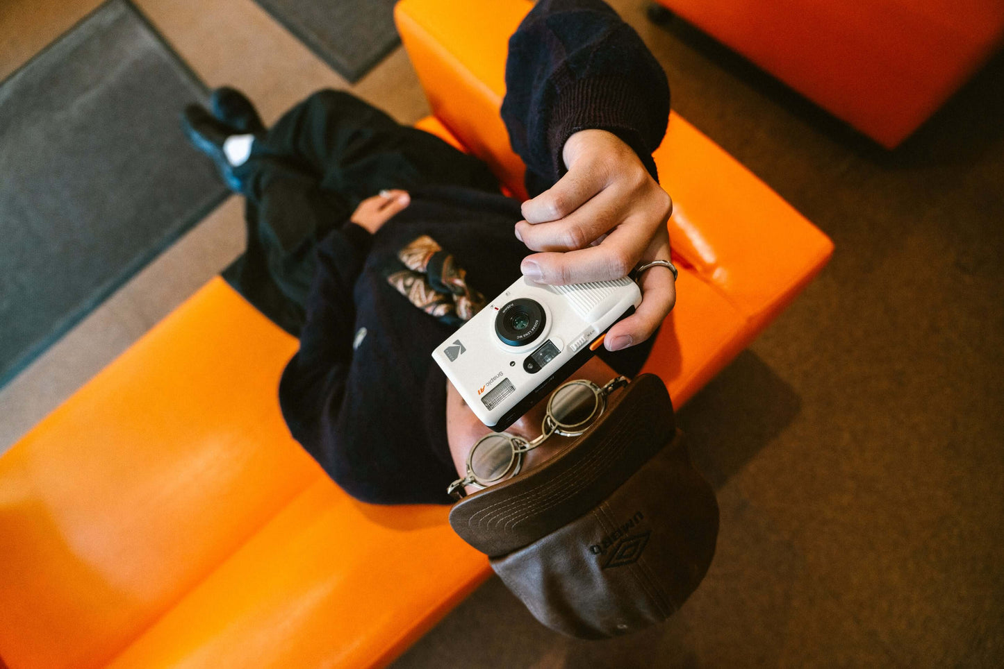 Person holding the Kodak Snapic A1 35mm camera pointing at the ceiling.