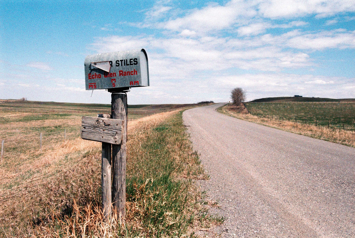 Street Candy Tasty 200 color negative film photo of Echo Glen Ranch mailbox along a country road.
