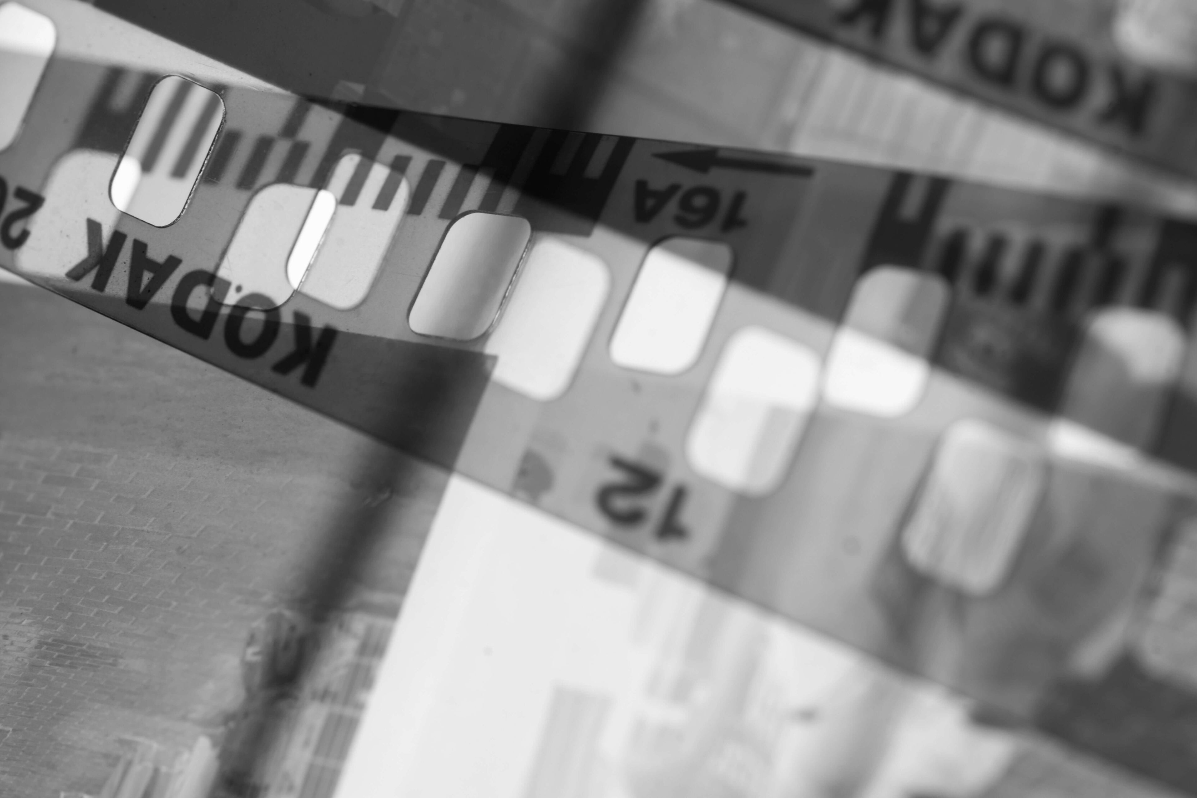 Black and white image of Kodak film strips highlighting the black and white developing process.