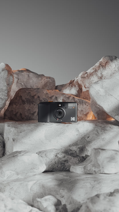 Video of the new Kodak Snapic A1 35mm camera sitting on a pile of rocks.